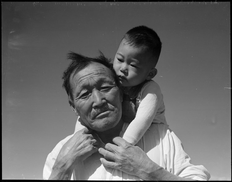 Manzanar Relocation Center, Manzanar, California. Grandfather and grandson of Japanese ancestry at this War Relocation Authority center.