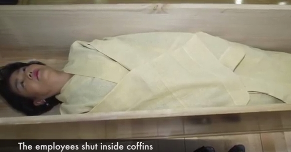 Korean companies are ordering employees to be shut inside coffins