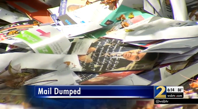 U.S. postal carrier filmed dumping bins of mail into a ditch