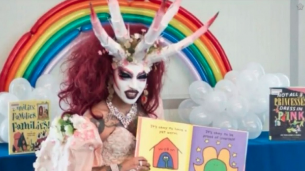 SATANIC agenda now in the open: Demonic LGBT drag queen reads story time books to children at Michelle Obama library in California